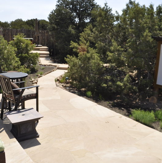 Flagstone patio with Coyote fence. Developed by Serrano Landscape.